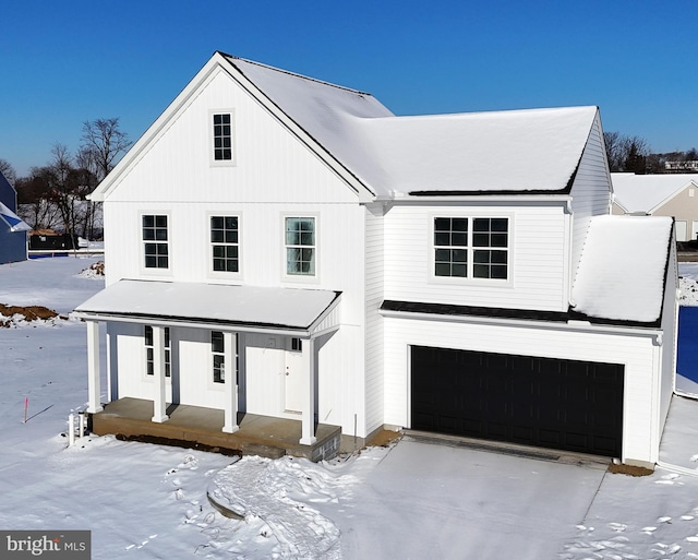 view of front of home with a garage and covered porch