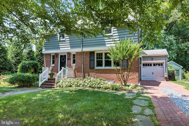 view of front of house featuring a garage, an outdoor structure, and a front lawn