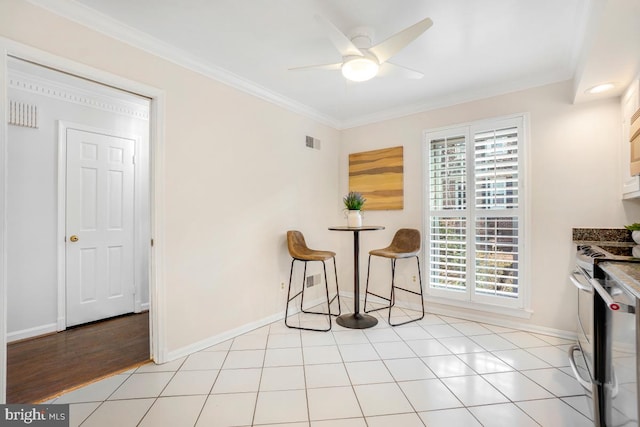 living area featuring crown molding, ceiling fan, and light tile patterned floors