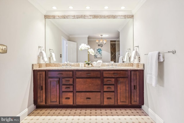 bathroom featuring vanity, ornamental molding, and an inviting chandelier