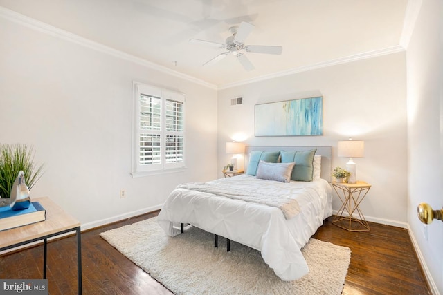 bedroom with ornamental molding, dark wood-type flooring, and ceiling fan