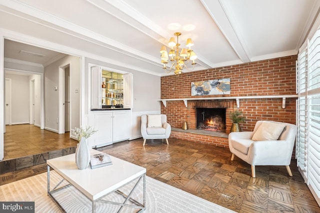 living room with brick wall, parquet flooring, crown molding, a brick fireplace, and beam ceiling