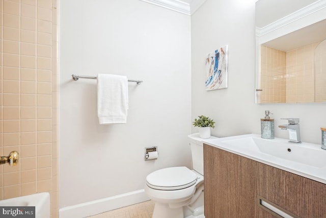 bathroom featuring vanity, crown molding, and toilet