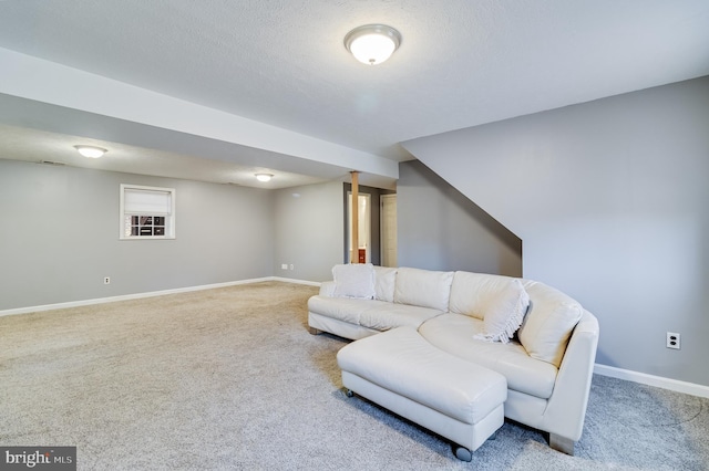 living room with carpet floors and a textured ceiling