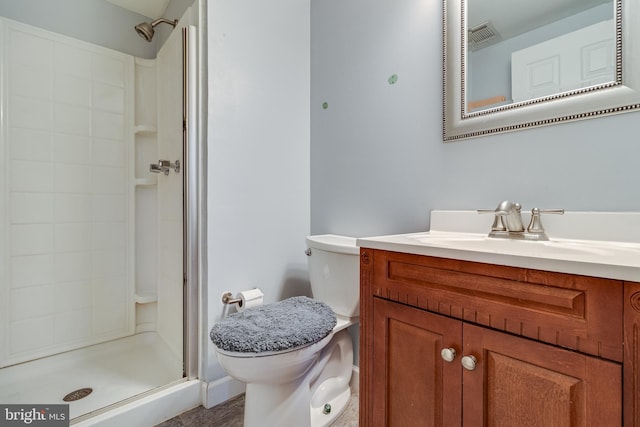 bathroom featuring a shower, vanity, and toilet