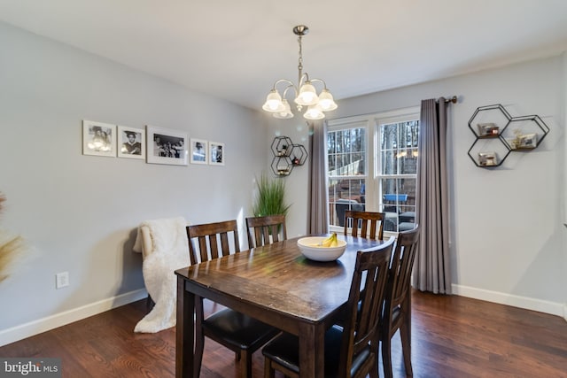 dining space featuring an inviting chandelier and dark wood-type flooring