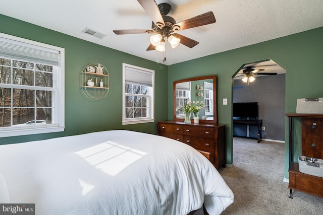 carpeted bedroom with ceiling fan