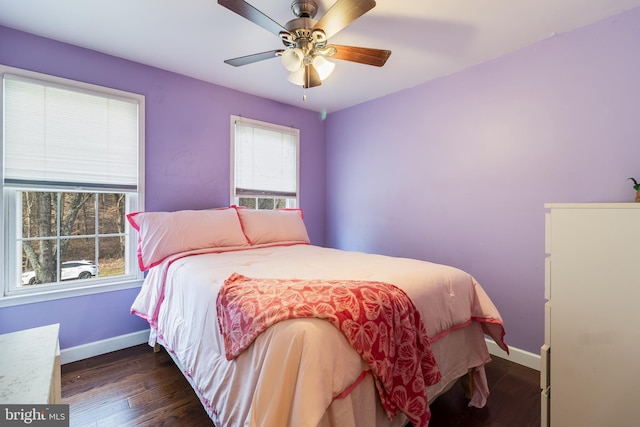 bedroom featuring ceiling fan and dark hardwood / wood-style flooring