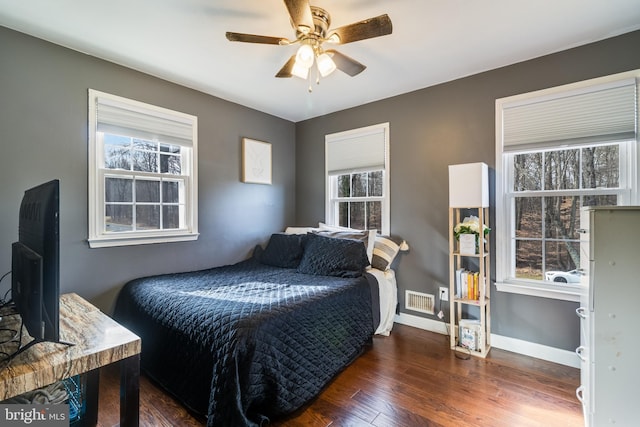 bedroom featuring dark hardwood / wood-style floors and ceiling fan