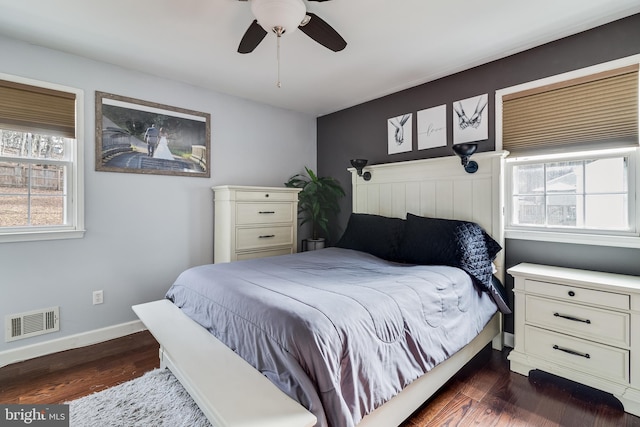 bedroom with dark wood-type flooring and ceiling fan