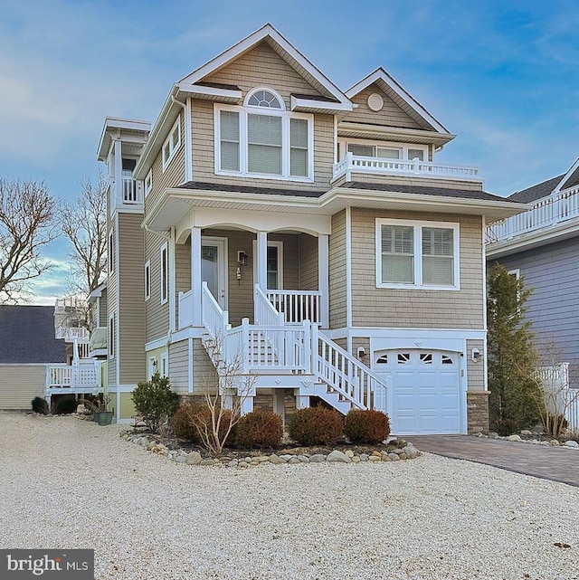 view of front of home featuring a garage and a porch