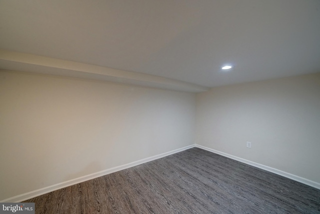 unfurnished room featuring dark hardwood / wood-style floors