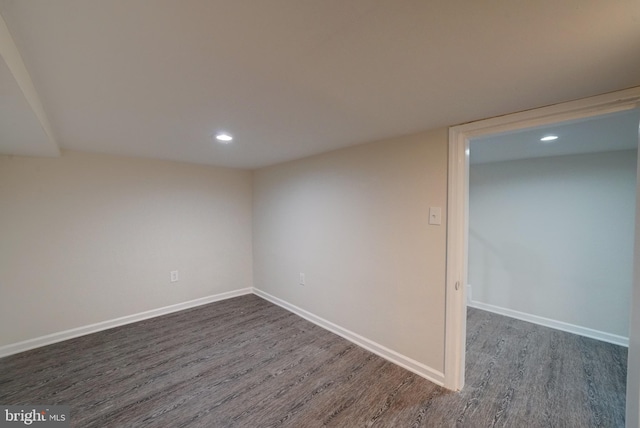 unfurnished room featuring dark hardwood / wood-style flooring