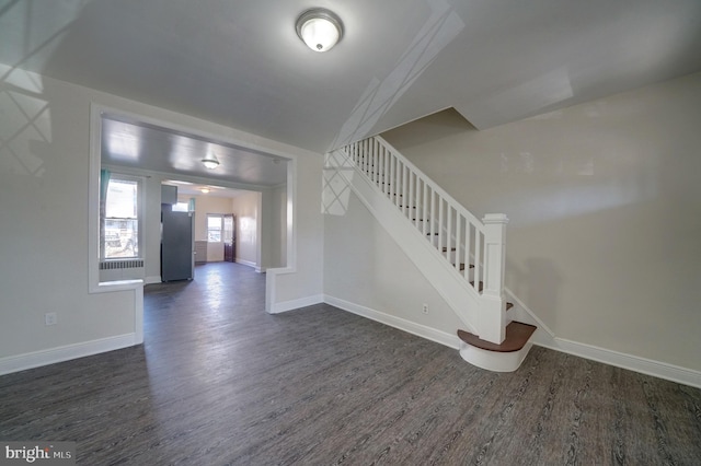 staircase with wood-type flooring