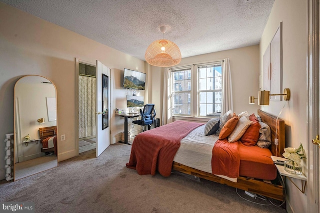 carpeted bedroom with a textured ceiling