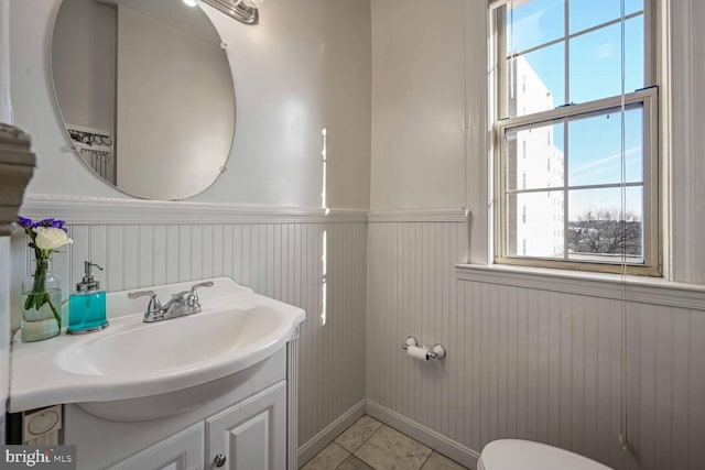 bathroom with tile patterned floors and vanity