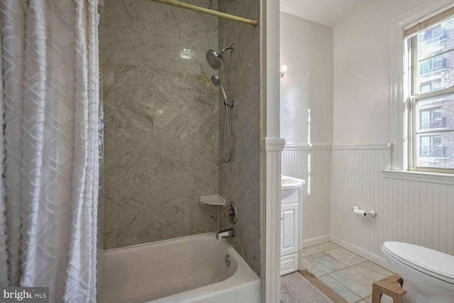 bathroom featuring a wealth of natural light, toilet, and shower / bath combo