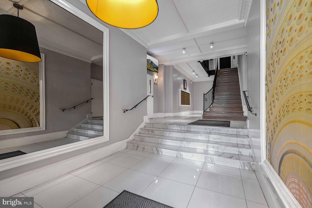 stairs featuring crown molding and tile patterned floors