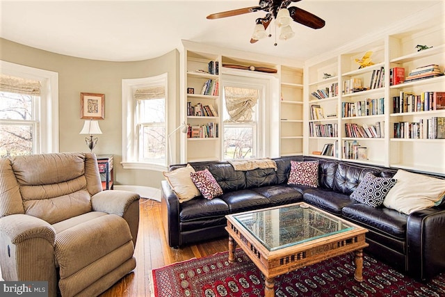 living room with ceiling fan and wood-type flooring