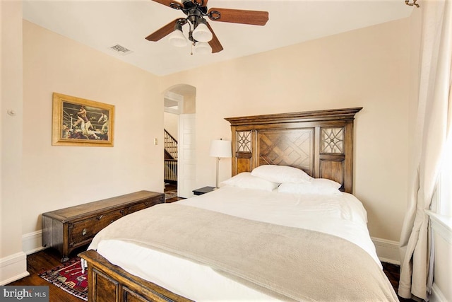 bedroom featuring ceiling fan and dark hardwood / wood-style flooring