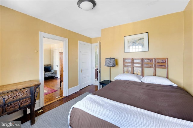 bedroom featuring dark hardwood / wood-style floors