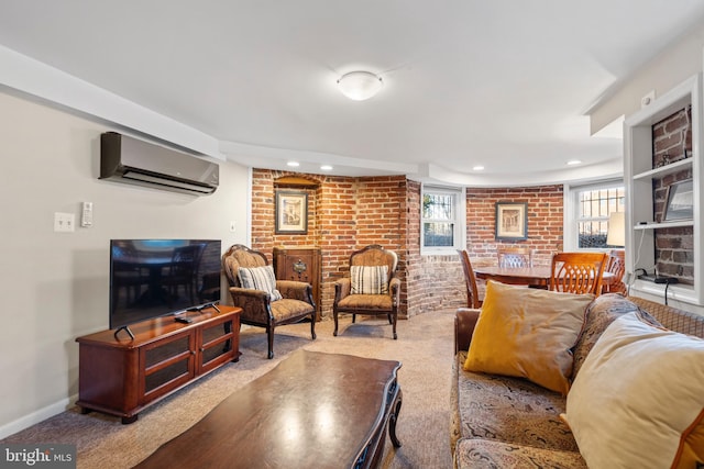 carpeted living room featuring brick wall and a wall mounted AC