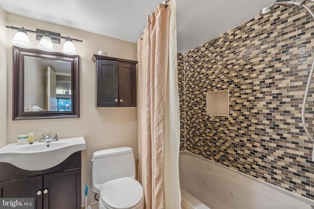 full bathroom with vanity, toilet, and shower / bath combo with shower curtain