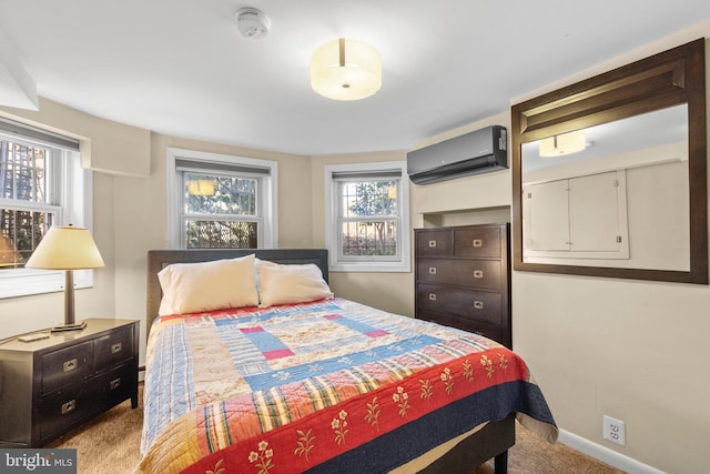 carpeted bedroom with an AC wall unit