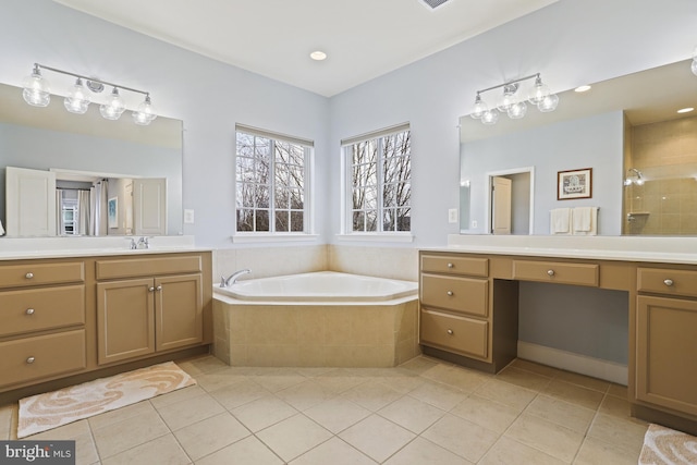 bathroom with vanity, shower with separate bathtub, and tile patterned floors