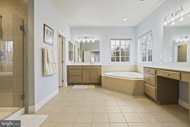 bathroom featuring tile patterned flooring, vanity, and separate shower and tub