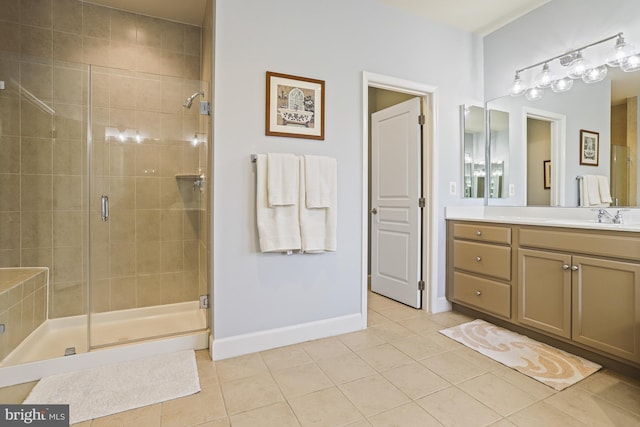 bathroom with vanity, tile patterned floors, and walk in shower