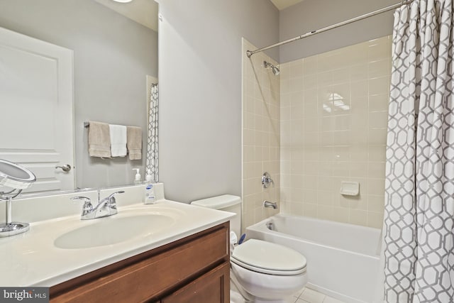 full bathroom with vanity, shower / tub combo, and toilet