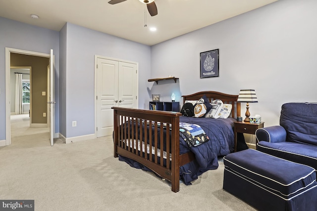 bedroom with light colored carpet and ceiling fan