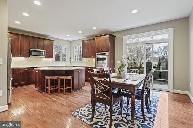 dining area with light wood-type flooring