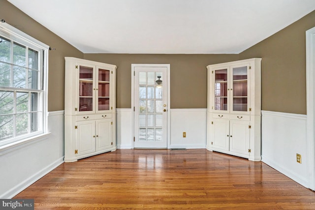 empty room with light hardwood / wood-style floors