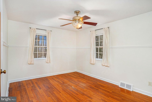 unfurnished room featuring hardwood / wood-style flooring and ceiling fan