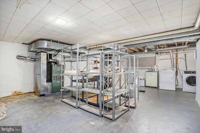 basement with separate washer and dryer and heating unit