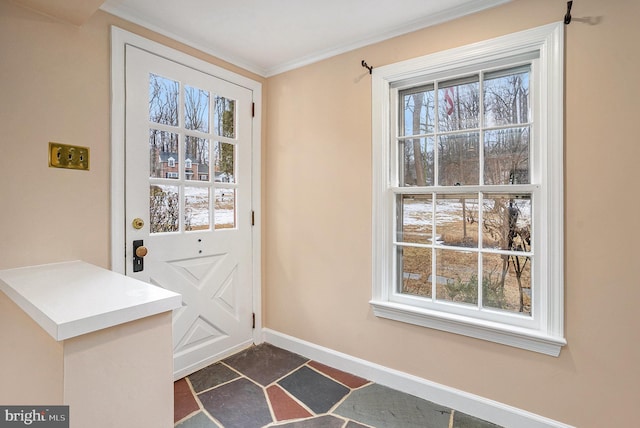 doorway to outside with ornamental molding and a healthy amount of sunlight