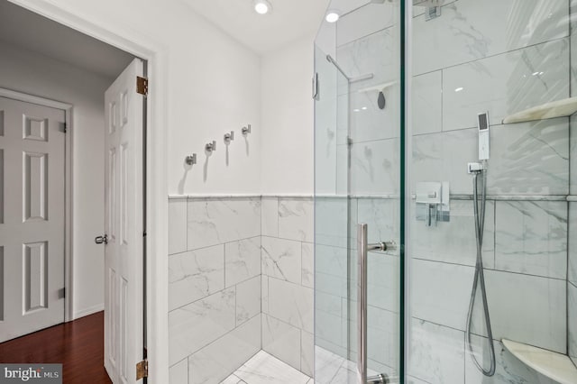 bathroom with a shower with shower door