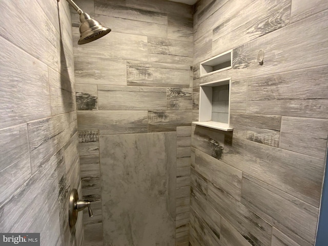 bathroom with tiled shower