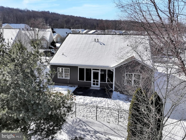 view of snow covered property