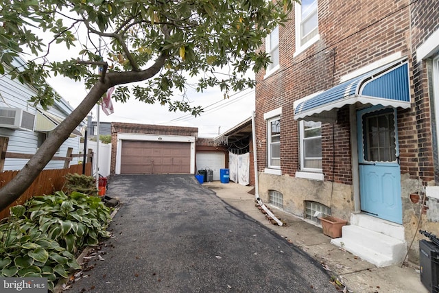 view of side of home featuring a garage