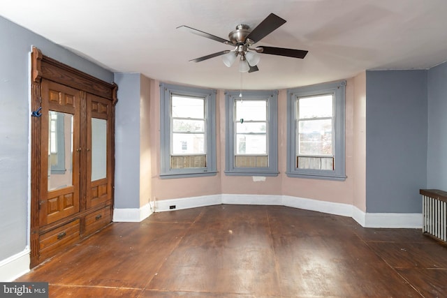 foyer entrance featuring dark hardwood / wood-style floors and ceiling fan