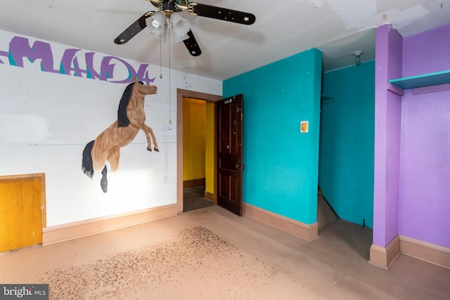 interior space with concrete floors and ceiling fan