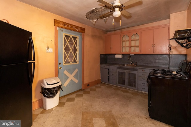 kitchen with sink, black appliances, and ceiling fan