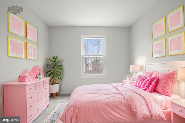 bedroom featuring light colored carpet