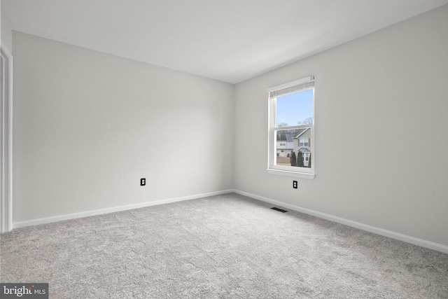 unfurnished room with carpet