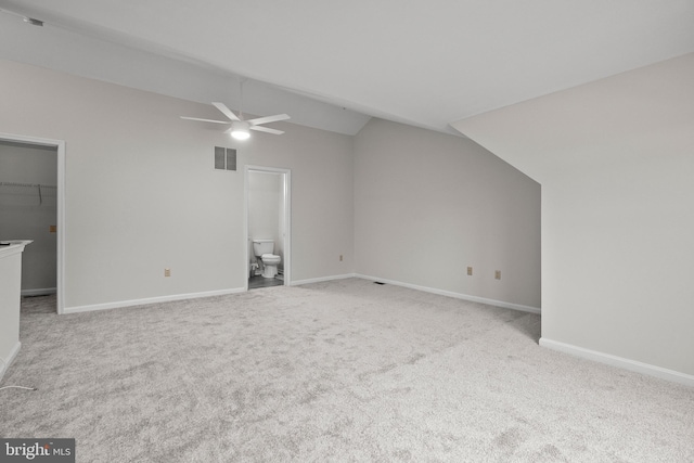 bonus room with lofted ceiling, light colored carpet, and ceiling fan