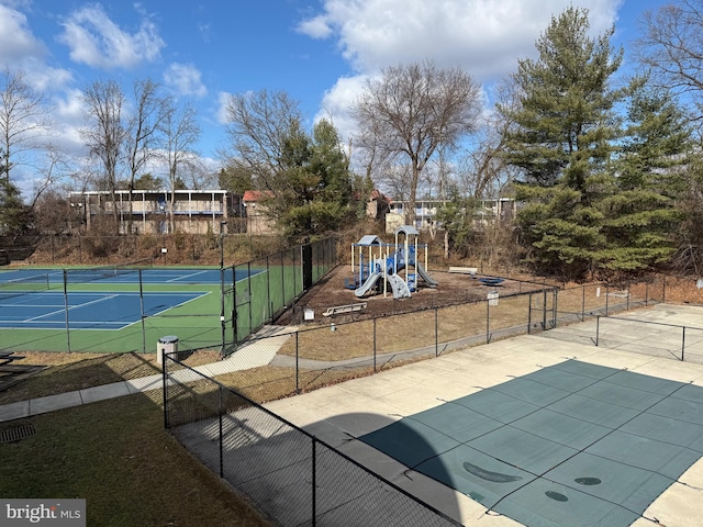 view of home's community featuring a playground and tennis court