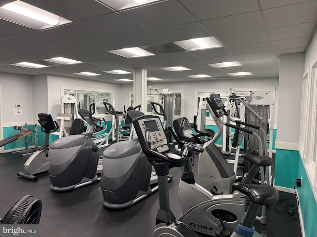 gym featuring a paneled ceiling